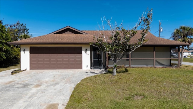 ranch-style house with a garage and a front lawn