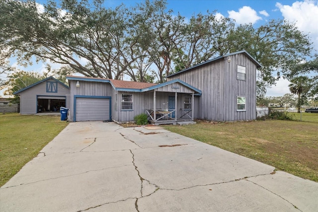 view of front of home featuring a garage, a front lawn, and a porch