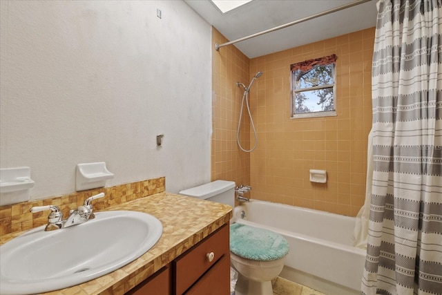 full bathroom with vanity, toilet, and shower / bath combo with shower curtain