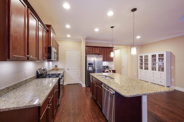 kitchen featuring light stone countertops, dark hardwood / wood-style flooring, stainless steel appliances, an island with sink, and hanging light fixtures