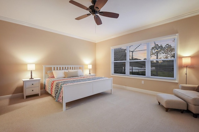 carpeted bedroom featuring ceiling fan and ornamental molding