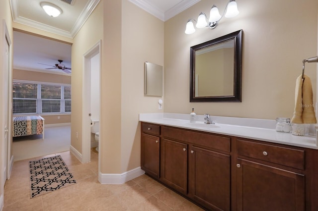 bathroom with tile patterned floors, vanity, toilet, ornamental molding, and ceiling fan