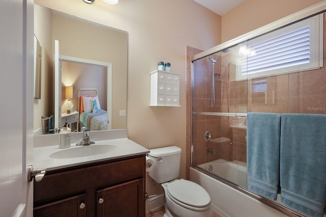 full bathroom with toilet, vanity, and combined bath / shower with glass door