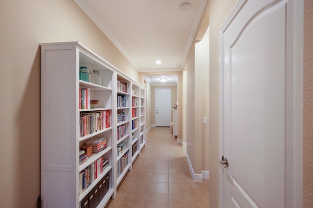 hall featuring crown molding and light tile patterned floors