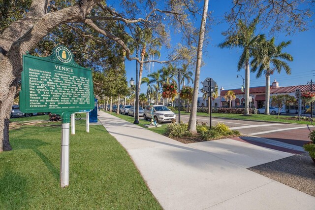 176 Avens Dr, Nokomis, FL 34275 - view of street featuring traffic signs, sidewalks, and street lights