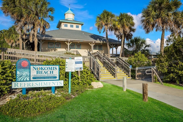 176 Avens Dr, Nokomis, FL 34275 - view of building exterior with fence and stairway