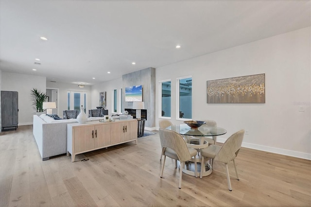 dining space featuring light wood-type flooring