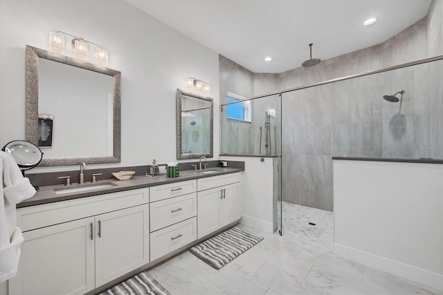 bathroom featuring vanity and a tile shower