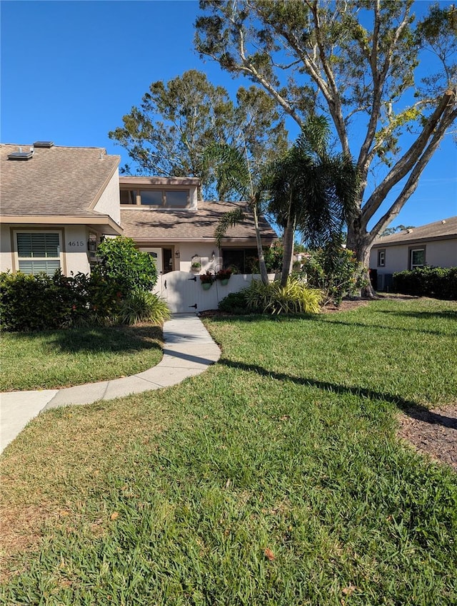 view of front of property with a front lawn