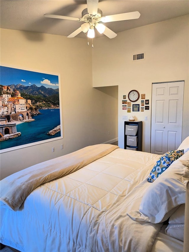 bedroom featuring ceiling fan and a closet