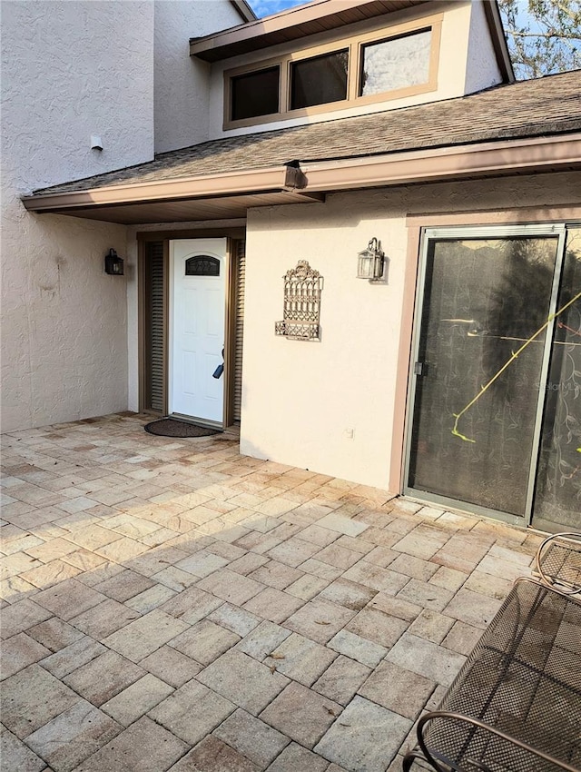 doorway to property featuring a patio