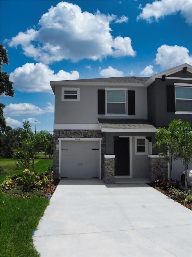 view of front of property with a garage