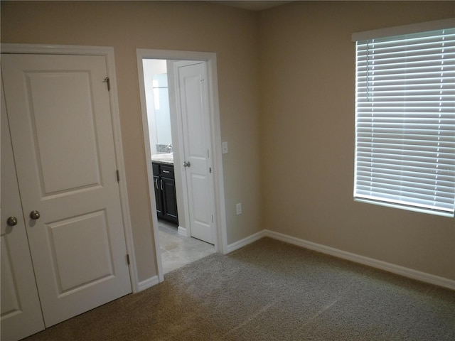 empty room with light colored carpet