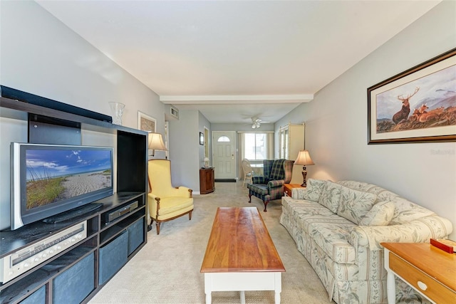 living room with light carpet and beam ceiling