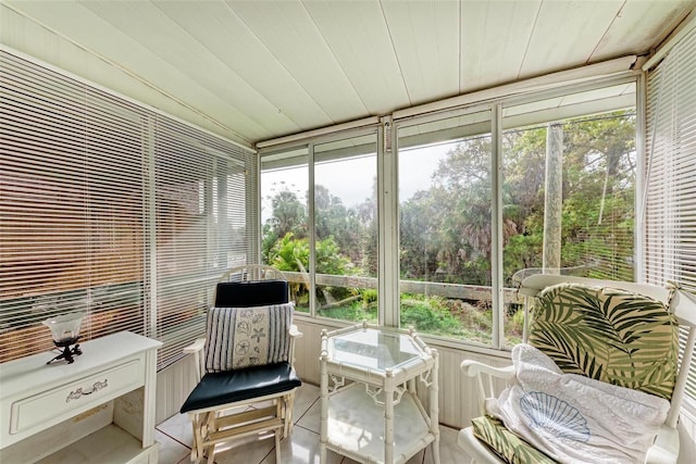 sunroom / solarium with wooden ceiling and a healthy amount of sunlight