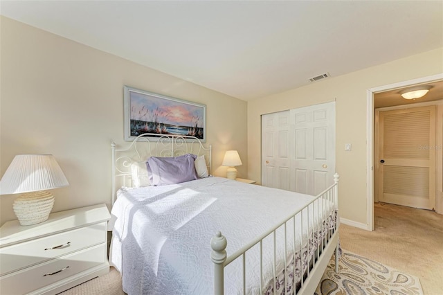 carpeted bedroom featuring a closet