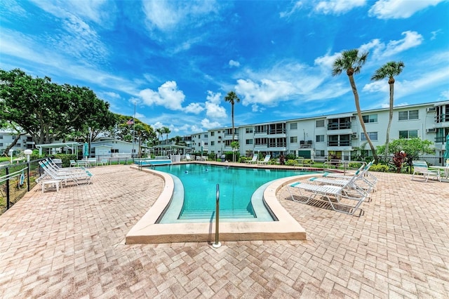 view of swimming pool featuring a patio area