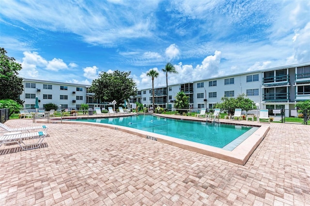 view of swimming pool featuring a patio