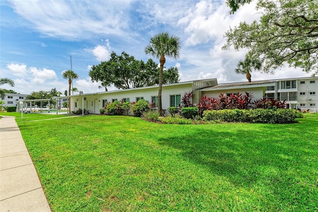 ranch-style home featuring a front yard