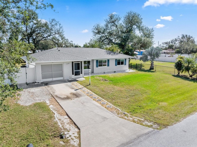 ranch-style house with a garage and a front yard