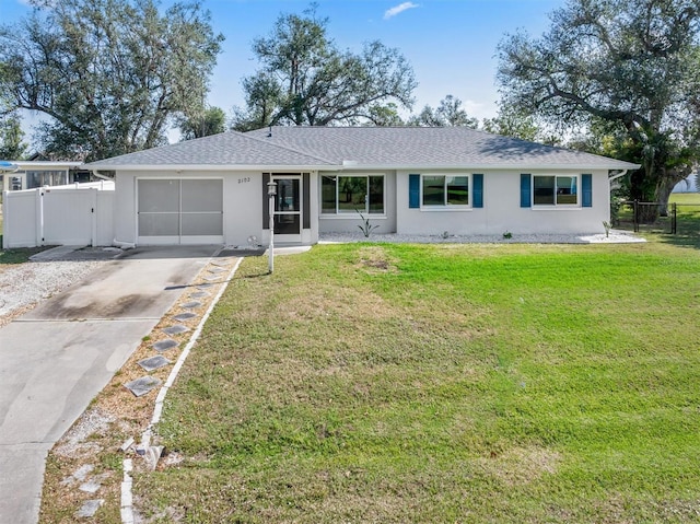 single story home with a front lawn