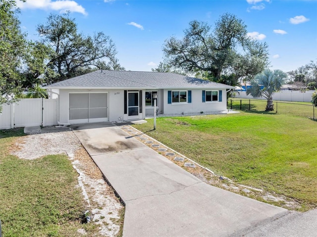 single story home with a garage and a front lawn