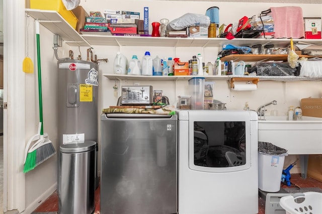 laundry area featuring separate washer and dryer, sink, and electric water heater