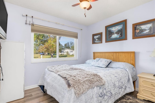 bedroom featuring ceiling fan and light wood-type flooring