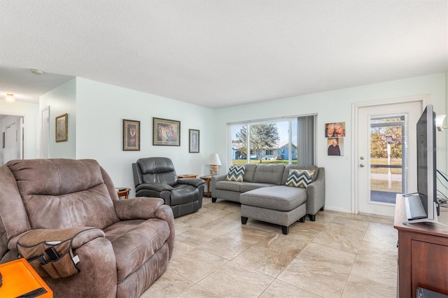 living room featuring a textured ceiling