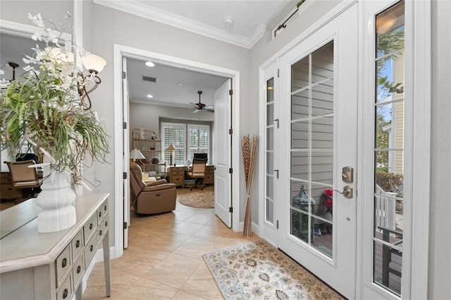 doorway featuring light tile patterned floors, ornamental molding, and french doors