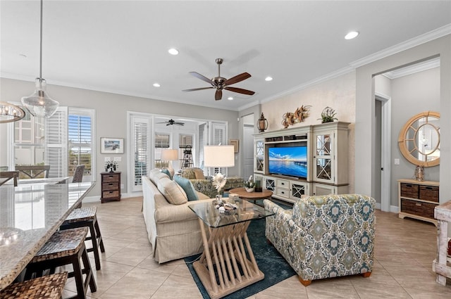 living room with ornamental molding, ceiling fan, and light tile patterned flooring