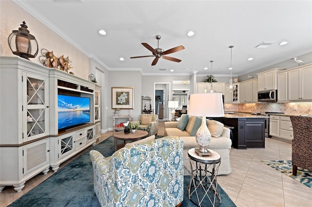 living room featuring crown molding, light tile patterned floors, and ceiling fan