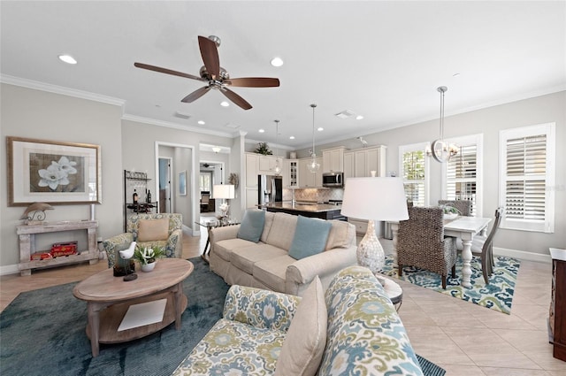 tiled living room featuring crown molding and ceiling fan with notable chandelier