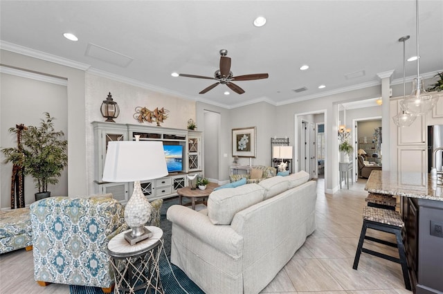 living room with ceiling fan and ornamental molding