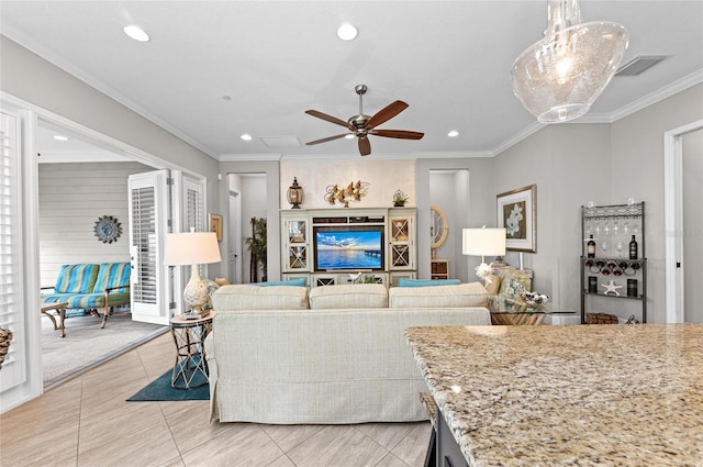 living room with crown molding, light tile patterned flooring, and ceiling fan