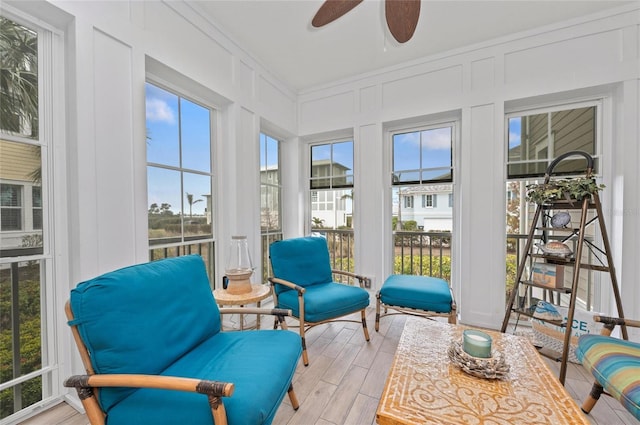 sunroom featuring ceiling fan