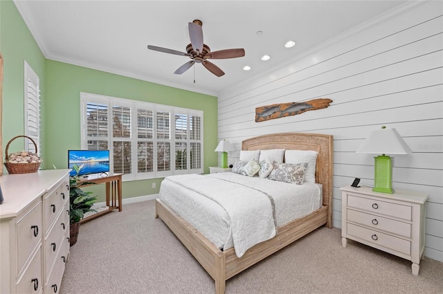 carpeted bedroom with crown molding and ceiling fan