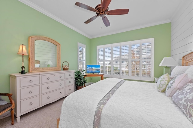 bedroom featuring crown molding, ceiling fan, and light carpet