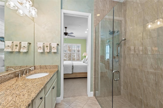 bathroom featuring tile patterned floors, an enclosed shower, crown molding, vanity, and ceiling fan