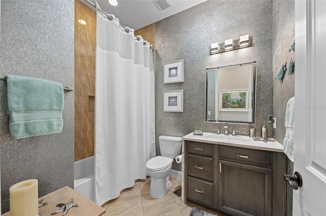 full bathroom featuring tile patterned floors, vanity, toilet, and shower / tub combo