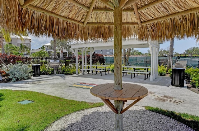 surrounding community with a gazebo and a patio area