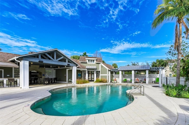 view of pool with a patio area and a pergola