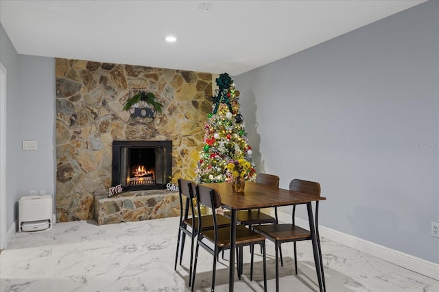 dining room featuring a fireplace