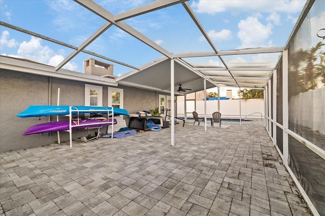 view of patio / terrace with ceiling fan and glass enclosure