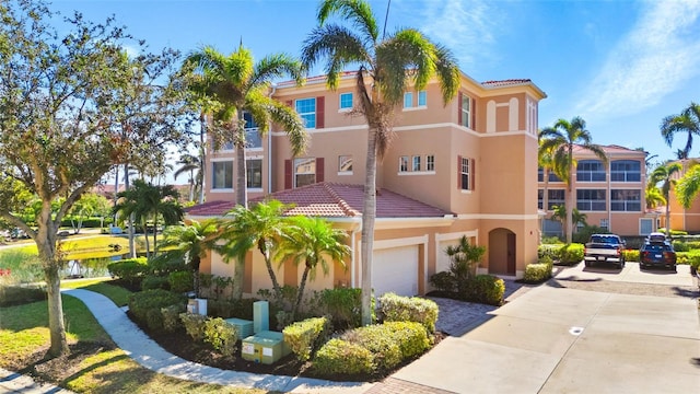 mediterranean / spanish-style house featuring a garage