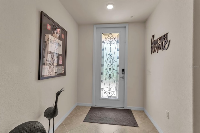 entrance foyer featuring light tile patterned floors