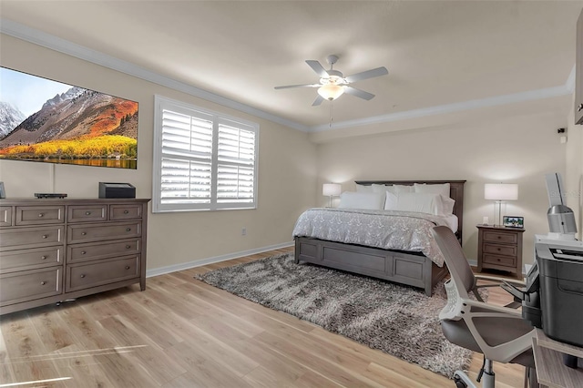 bedroom with crown molding, light hardwood / wood-style floors, and ceiling fan