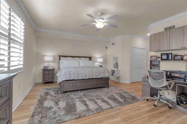 bedroom with crown molding, light hardwood / wood-style flooring, a closet, and ceiling fan