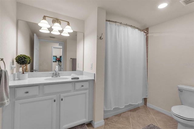 full bathroom with vanity, toilet, tile patterned flooring, and shower / bath combo with shower curtain