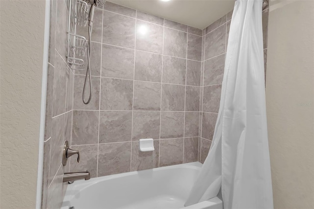 bathroom with shower / bath combination with curtain